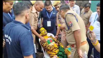 The Bangladeshi fan, Rabiul Islam, being taken to hospital after he fainted (Deepak Gupta)