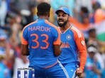 India's Hardik Pandya celebrates with Virat Kohli after South Africa's David Miller was caught out by Suryakumar Yadav in the T20 World Cup final.