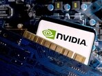 A smartphone with a displayed NVIDIA logo is placed on a computer motherboard in this illustration taken March 6, 2023.