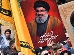 Demonstrators hold flags and pictures of Hassan Nasrallah, late leader of the Lebanese group Hezbollah, at a protest rally. Demonstrators hold flags and pictures of Hassan Nasrallah, late leader of the Lebanese group Hezbollah, at a protest rally.