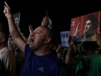 Demonstrators gesture as they carry pictures of Lebanon's Hezbollah leader Sayyed Hassan Nasrallah during a protest, following his killing in an Israeli airstrike in Beirut's southern suburbs on Friday.