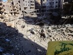 AHezbollah flag flies amid of the rubble of buildings which were levelled on September 27 by Israeli strikes that targeted and killed Hezbollah leader Hassan Nasrallah in the Haret Hreik neighbourhood of Beirut's southern suburbs. AHezbollah flag flies amid of the rubble of buildings which were levelled on September 27 by Israeli strikes that targeted and killed Hezbollah leader Hassan Nasrallah in the Haret Hreik neighbourhood of Beirut's southern suburbs.