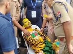 The Bangladeshi fan, Rabiul Islam, being taken to hospital after he fainted (Deepak Gupta)