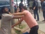In the video, several men can be seen thrashing each other on a service road in Uttar Pradesh even as dozens watch them brawl. In the video, several men can be seen thrashing each other on a service road in Uttar Pradesh even as dozens watch them brawl.