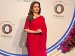 Nita Ambani stunned in a red saree, radiating 90s Bollywood aesthetic. Nita Ambani stunned in a red saree, radiating 90s Bollywood aesthetic.