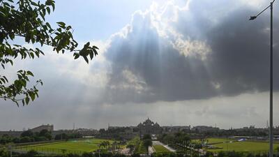 Dark clouds give way to sunlight near Akshardham on Sunday. (Sanjeev Verma/HT Photo) Dark clouds give way to sunlight near Akshardham on Sunday. (Sanjeev Verma/HT Photo)