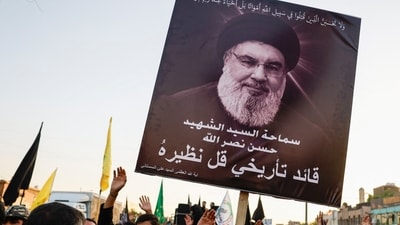 A person holds a poster of Lebanon's Hezbollah Chief Hassan Nasrallah who was killed by an Israeli airstrike in Beirut, during a symbolic funeral in Baghdad, Iraq, September 29, 2024. REUTERS/Thaier al-Sudani (REUTERS)