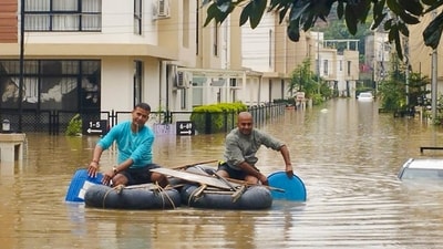 People travel using a boat in Kathmandu at a flood-affected area following heavy rainfall (PTI Photo) (PTI) People travel using a boat in Kathmandu at a flood-affected area following heavy rainfall (PTI Photo) (PTI)