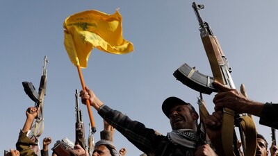 A file photo of Houthi supporters raising a Hezbollah flag during an anti-Israel and anti-U.S. rally in Sanaa, Yemen. (AP) A file photo of Houthi supporters raising a Hezbollah flag during an anti-Israel and anti-U.S. rally in Sanaa, Yemen. (AP)