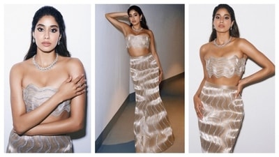 Janhvi Kapoor slayed in this shimmery, metallic ensemble. The two-piece had a glistening wavy design, etched into the fabric that added to the glam. The strapless top too was shaped in a whimsical wavy structure. The matching high-waisted skirt, too had the same wavy pattern. It trailed elegantly to the floor, accentuating her figure while maintaining a sleek and sophisticated silhouette. She channeled mermaid aesthetic with this look. (Instagram/@janhvikapoor) Janhvi Kapoor slayed in this shimmery, metallic ensemble. The two-piece had a glistening wavy design, etched into the fabric that added to the glam. The strapless top too was shaped in a whimsical wavy structure. The matching high-waisted skirt, too had the same wavy pattern. It trailed elegantly to the floor, accentuating her figure while maintaining a sleek and sophisticated silhouette. She channeled mermaid aesthetic with this look. (Instagram/@janhvikapoor)