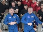 In this image made from a NASA livestream, the two astronauts stuck at the International Space Station since June 2024, Butch Wilmore, far left, and Suni Williams, far right, welcome two new residents who flew up on SpaceX, NASA's Nick Hague, front left in blue, and the Russian Space Agency's Alexander Gorbunov, front right in blue, Sunday, Sept. 29, 2024. Behind them, from left in black, are NASA's Jeanette Epps, Russia's Alexander Grebenkin, NASA's Mike Barratt and NASA's Matthew Dominick. From left, wearing red, are Russia's Ivan Vagner, NASA's Don Pettit and Russia's Alexei 