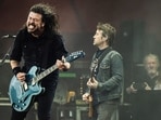 US musician Dave Grohl of rock band Foo Fighters performs on the Orange Stage at Roskilde Festival on July 5, 2024 in Roskilde, Denmark. (Photo by Helle Arensbak / Ritzau Scanpix / AFP) / Denmark OUT