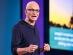 Satya Nadella highlighted AI's potential to improve productivity across sectors like healthcare and finance. While acknowledging current challenges in AI's profitability, he encouraged professionals to adapt and embrace technology for long-term benefits.