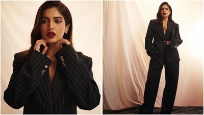Bhumi Pednekar is a fan of power suits, and her latest look is proof of that. She stuns in a black oversized blazer and matching relaxed-fit pants. With bold red lips, she perfectly finished off her boss babe look. (Instagram/@bhumipednekar) Bhumi Pednekar is a fan of power suits, and her latest look is proof of that. She stuns in a black oversized blazer and matching relaxed-fit pants. With bold red lips, she perfectly finished off her boss babe look. (Instagram/@bhumipednekar)