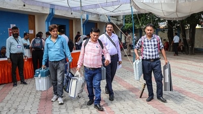 Polling officials carrying EVMs and other election materials before leaving for their respective polling stations on the eve of the final phase of the Jammu and Kashmir Assembly elections (ANI Photo) (Aman Sharma) Polling officials carrying EVMs and other election materials before leaving for their respective polling stations on the eve of the final phase of the Jammu and Kashmir Assembly elections (ANI Photo) (Aman Sharma)