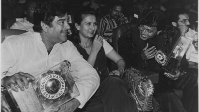 Mithun Chakraborty seen sharing a light moment with actors Shatrughan Sinha and Poonam Dhillon after receiving the Great Achievers of India Award at a function in New Delhi in 1994. Mithun Chakraborty seen sharing a light moment with actors Shatrughan Sinha and Poonam Dhillon after receiving the Great Achievers of India Award at a function in New Delhi in 1994.