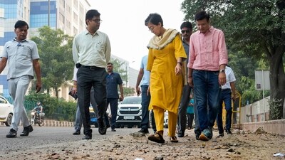 Delhi Chief Minister Atishi inspects condition of a road at NSIC Estate, Okhla Industrial Estate, in New Delhi on Monday. (PTI) Delhi Chief Minister Atishi inspects condition of a road at NSIC Estate, Okhla Industrial Estate, in New Delhi on Monday. (PTI)
