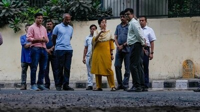Delhi Chief Minister Atishi inspects condition of a road at NSIC Estate, Okhla Industrial Estate in New Delhi on Monday. (PTI) Delhi Chief Minister Atishi inspects condition of a road at NSIC Estate, Okhla Industrial Estate in New Delhi on Monday. (PTI)