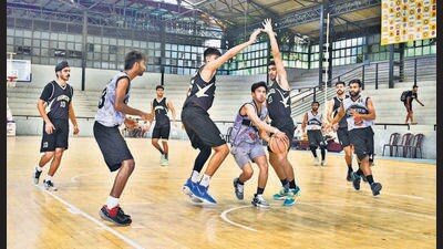 Players in action during the basketball championship in Ludhiana on Monday. (HT Photo)