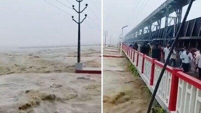 Dozens of people can be seen running off a bridge and screaming as the Kosi river's fast flowing water begins to touch it. (X/@Ranjeet4India) Dozens of people can be seen running off a bridge and screaming as the Kosi river's fast flowing water begins to touch it. (X/@Ranjeet4India)