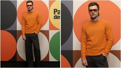 Harry Styles recently attended an event in a chic look, wearing an orange sweater and black flared pants. He styled his look with an orange-tinted glasses for a completely dapper vibe. (Instagram/@JustJared) Harry Styles recently attended an event in a chic look, wearing an orange sweater and black flared pants. He styled his look with an orange-tinted glasses for a completely dapper vibe. (Instagram/@JustJared)