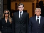 Former President Donald Trump, center right, stands with his wife Melania, second left, their son Barron, center left, as the coffin carrying the remains of Amalija Knavs, the former first lady's mother, is carried into the Church of Bethesda-by-the-Sea for her funeral, Thursday, Jan. 18, 2024, in Palm Beach, Fla. (AP Photo/Rebecca Blackwell) Former President Donald Trump, center right, stands with his wife Melania, second left, their son Barron, center left, as the coffin carrying the remains of Amalija Knavs, the former first lady's mother, is carried into the Church of Bethesda-by-the-Sea for her funeral, Thursday, Jan. 18, 2024, in Palm Beach, Fla. (AP Photo/Rebecca Blackwell)