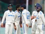 India's Ravindra Jadeja, second left, celebrates with teammate the wicket of Bangladesh's Shakib Al Hasan on the fifth and final day of the second cricket test match between Bangladesh and India in Kanpur India's Ravindra Jadeja, second left, celebrates with teammate the wicket of Bangladesh's Shakib Al Hasan on the fifth and final day of the second cricket test match between Bangladesh and India in Kanpur