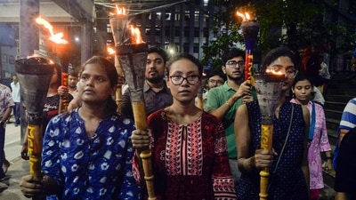 Junior doctors take out a torch rally as they stage a protest against the alleged sexual assault and murder of a postgraduate trainee doctor of the RG Kar Hospital, in Kolkata on Sunday. (ANI Photo) Junior doctors take out a torch rally as they stage a protest against the alleged sexual assault and murder of a postgraduate trainee doctor of the RG Kar Hospital, in Kolkata on Sunday. (ANI Photo)