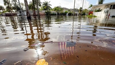 An American flag sits in floodwaters in the aftermath of Hurricane Helene in the Shore Acres neighborhood Friday, Sept. 27, 2024, in St. Petersburg, Fla. (AP Photo/Mike Carlson) (AP) An American flag sits in floodwaters in the aftermath of Hurricane Helene in the Shore Acres neighborhood Friday, Sept. 27, 2024, in St. Petersburg, Fla. (AP Photo/Mike Carlson) (AP)