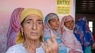 A woman shows her finger marked with indelible ink after casting vote at a polling station during the third and final phase of the Jammu and Kashmir Assembly elections, Singhpora, in Baramulla district. (PTI) A woman shows her finger marked with indelible ink after casting vote at a polling station during the third and final phase of the Jammu and Kashmir Assembly elections, Singhpora, in Baramulla district. (PTI)