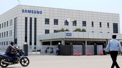 Samsung plant protests: A motorcyclist rides past Samsung company plant in Sriperumbudur, on the outskirts of Chennai. (AP) Samsung plant protests: A motorcyclist rides past Samsung company plant in Sriperumbudur, on the outskirts of Chennai. (AP)