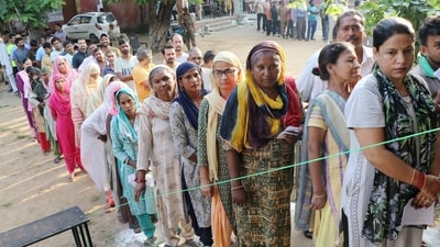 Women wait in a queue to cast their votes at a polling booth during the third and final phase of Jammu & Kashmir Assembly elections in Jammu. (PTI) Women wait in a queue to cast their votes at a polling booth during the third and final phase of Jammu & Kashmir Assembly elections in Jammu. (PTI)
