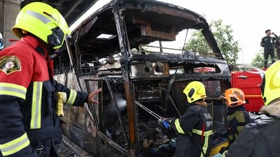 Firefighters work to extinguish a burning bus that was carrying teachers and students from Wat Khao Phraya school, reportedly killing almost a dozen, on the outskirts of Bangkok, Thailand, October 1, 2024. (REUTERS)