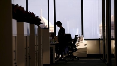 An employee of software company Nuix stands in their office located in central Sydney, Australia. (REUTERS)