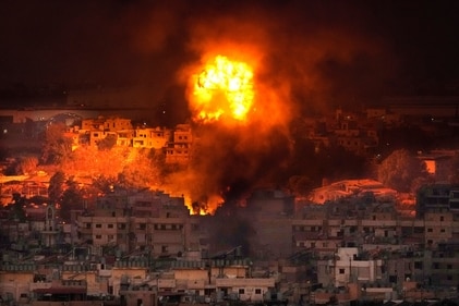 Flames rise after an Israeli airstrike in the southern suburbs of Beirut, Lebanon. (AP) Flames rise after an Israeli airstrike in the southern suburbs of Beirut, Lebanon. (AP)