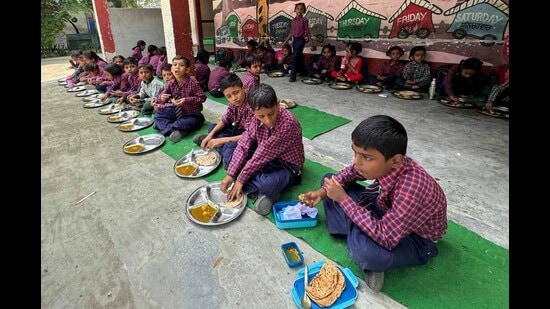 Government school students having mid-day meal in Ludhiana. (HT File)