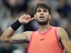 Carlos Alcaraz of Spain gestures during their men's singles finals match against Jannik Sinner of Italy at the China Open tennis tournament, National Tennis Center in Beijing, Wednesday. Carlos Alcaraz of Spain gestures during their men's singles finals match against Jannik Sinner of Italy at the China Open tennis tournament, National Tennis Center in Beijing, Wednesday.