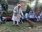PM Modi during a cleanliness drive along with some school students to mark the 10th anniversary of Swachhata Bharat campaign.