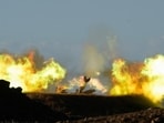An Israeli mobile artillery unit fires a shell from northern Israel towards Lebanon. Oil prices rose as Iran launched missiles at Israel, prompting threats of retaliation and concerns over crude supply risks.