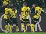 Dortmund's German forward #27 Karim Adeyemi celebrates with his team mates