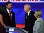 Democratic vice presidential nominee Minnesota Governor Tim Walz, and his wife Gwen, and Republican vice presidential nominee U.S. Senator JD Vance, and his wife Usha, speak at the end of the Vice Presidential debate hosted by CBS in New York, U.S., October 1, 2024. REUTERS/Mike Segar
