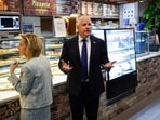 Tim Walz, the governor of Minnesota was spotted with Gwen at Justino's Pizza in Manhattan after nearly two hours of debate time against Trump's vice president pick. 