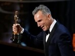 Daniel Day Lewis accepts the Oscar for best actor for his role in Lincoln at the 85th Academy Awards in 2017.