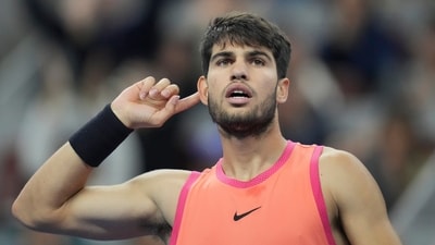 Carlos Alcaraz of Spain gestures during their men's singles finals match against Jannik Sinner of Italy at the China Open tennis tournament, National Tennis Center in Beijing, Wednesday. (AP) Carlos Alcaraz of Spain gestures during their men's singles finals match against Jannik Sinner of Italy at the China Open tennis tournament, National Tennis Center in Beijing, Wednesday. (AP)
