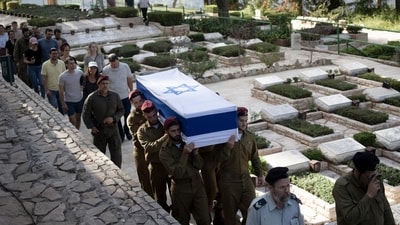 Soldiers carry the coffin of Israeli Army Capt. Eitan Yitzhak Oster, who was killed in Lebanon, during his funeral at Mt. Herzl military cemetery in Jerusalem, Wednesday, Oct. 2, 2024. (AP) Soldiers carry the coffin of Israeli Army Capt. Eitan Yitzhak Oster, who was killed in Lebanon, during his funeral at Mt. Herzl military cemetery in Jerusalem, Wednesday, Oct. 2, 2024. (AP)