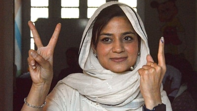 PDP candidate Iltija Mufti shows victory sign and her finger marked with indelible ink after casting her vote at Bejbehara polling station during the first phase of Jammu and Kashmir Assembly elections. (PTI) PDP candidate Iltija Mufti shows victory sign and her finger marked with indelible ink after casting her vote at Bejbehara polling station during the first phase of Jammu and Kashmir Assembly elections. (PTI)