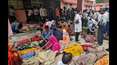 People mourn next to the bodies of victims of a stampede outside a hospital in Hathras district in the northern state of Uttar Pradesh, July 2, 2024. (REUTERS File)