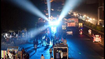 Revellers blare loud music during a procession ahead of Navratri at Sarai Kale Khan on Wednesday. (Arvind Yadav/HT PHOTO)
