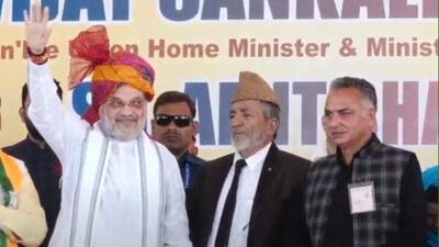 Union home minister Amit Shah campaigning for BJP candidate and former minister Syed Mushtaq Ahmed Bukhari (centre), while former chairman of the Bafliaz block development council and friend Shafiq Mir looks on at Surankote on September 21, ahead of the second phase polling in Jammu and Kashmir on September 25. (HTfile photo) Union home minister Amit Shah campaigning for BJP candidate and former minister Syed Mushtaq Ahmed Bukhari (centre), while former chairman of the Bafliaz block development council and friend Shafiq Mir looks on at Surankote on September 21, ahead of the second phase polling in Jammu and Kashmir on September 25. (HTfile photo)