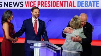 Democratic vice presidential candidate Minnesota Gov. Tim Walz and his wife Gwen Walz (R) embrace as Republican vice presidential candidate Sen. JD Vance (R-OH) and his wife Usha Vance look on after a debate at the CBS Broadcast Centre (Getty Images via AFP) Democratic vice presidential candidate Minnesota Gov. Tim Walz and his wife Gwen Walz (R) embrace as Republican vice presidential candidate Sen. JD Vance (R-OH) and his wife Usha Vance look on after a debate at the CBS Broadcast Centre (Getty Images via AFP)